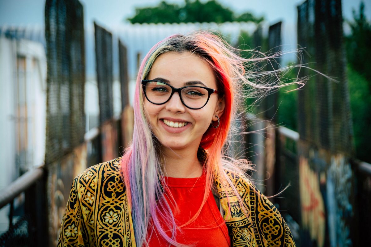 Colored hair young women smiling