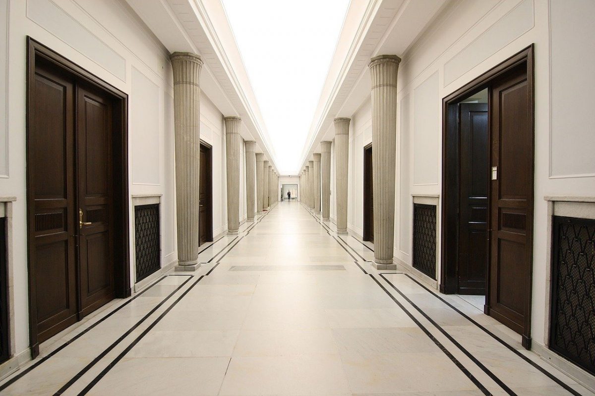 an empty highschool corridor and doors to classrooms
